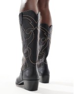 heeled western boot with stitching in black